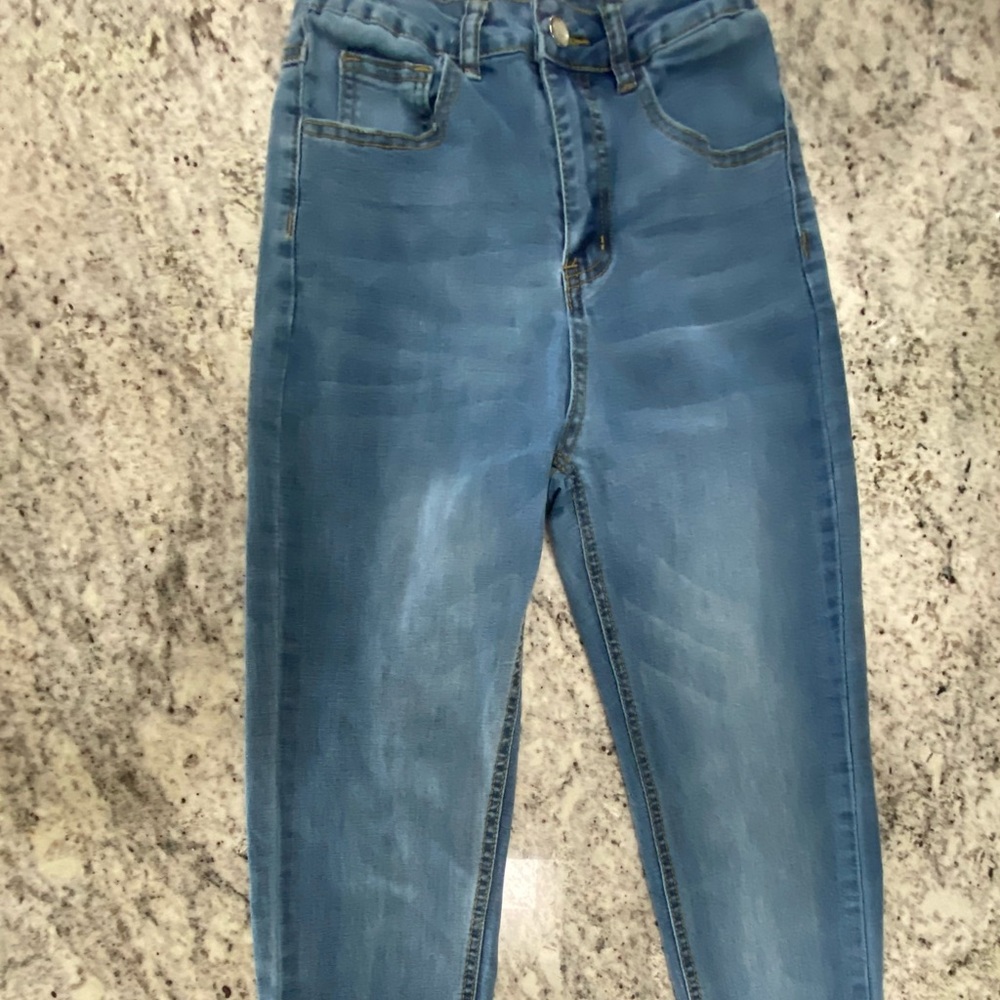 A pair of plain blue jeans